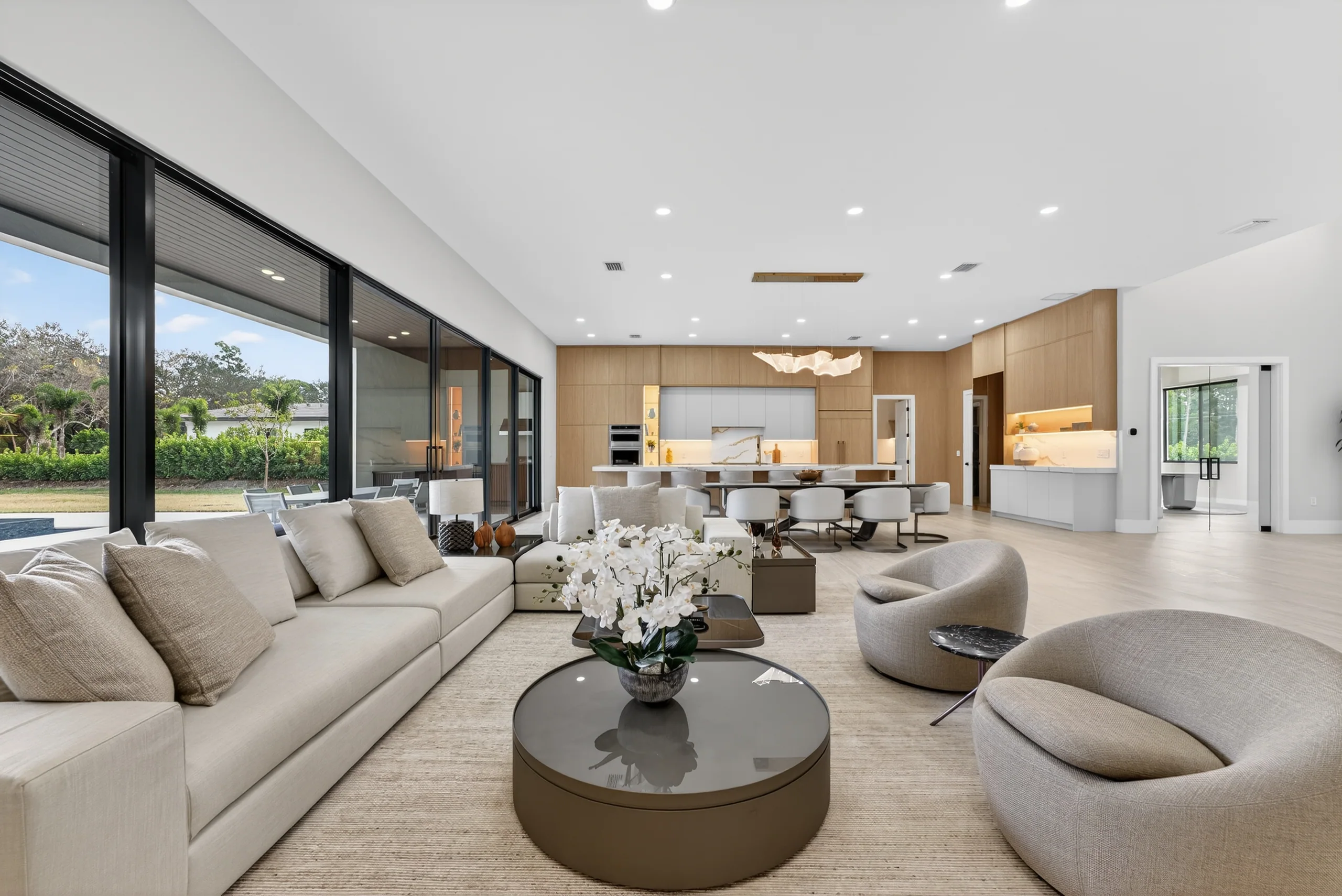 Open-plan living room with soft neutral furnishings